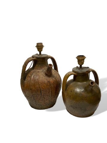 null 
LOT composed of two jugs with handles and two glazed earthenware drinking vessels....