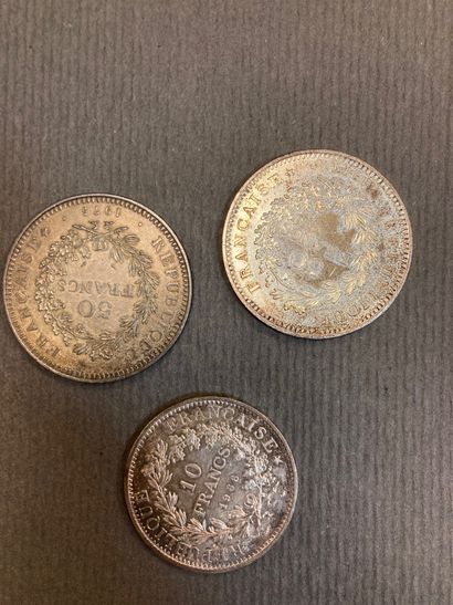2 coins of 50 francs and 1 coin of 10 francs...