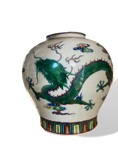 null A wucai-style porcelain and enamel globular vase decorated with a dragon and...