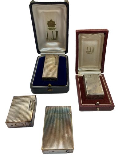 null DUNHILL
Set of four silver plated lighters, two of them in their box