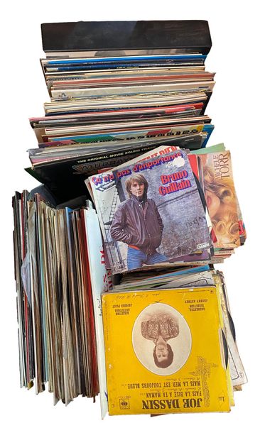 null Set of around 80 33 and 45 rpm vinyl records.