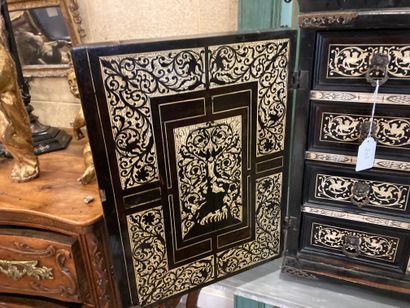null Cabinet in blackened wood, richly inlaid with bone, with an architectural front....