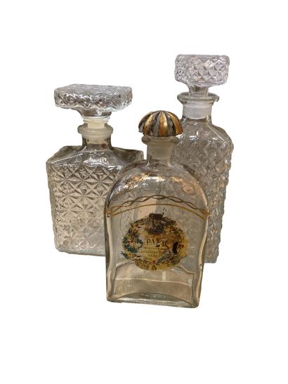 null Set including two whisky decanters, one gilded glass decanter, two molded glass...