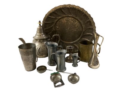null Set including three pewter measures, three pewter table ashtrays, a candlestick,...