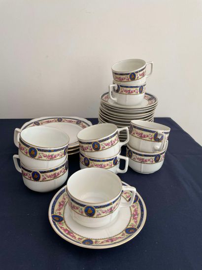 null Part of a porcelain service including nine cups, sixteen saucers and three dessert...