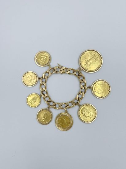  Bracelet en or jaune 18 carats (750 ) avec en pampilles : 1 pièce de 20 dollars...