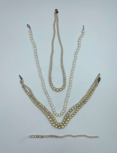 Three pearl necklaces + a part of a necklace....