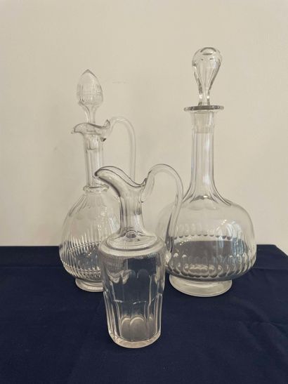 null Lot including a crystal carafe (stopper reported), a glass carafe and a small...