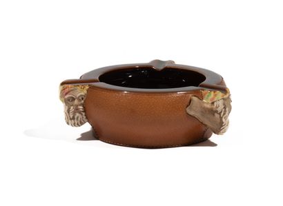 null LONGCHAMP :
Large ceramic ashtray covered with havana leather decorated with...