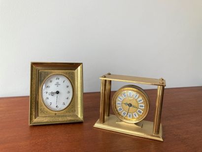 null Set of two gilt metal clocks, one by Uti, Swiza, with oval dial. 10 x 8.5 x...