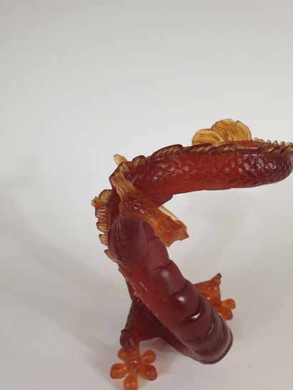 null Proof in amber-colored molded pâte de cristal depicting an upright dragon
20th...