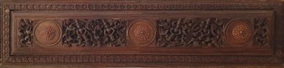 null Decorative panel in natural wood, molded and carved with two scenes of winged...