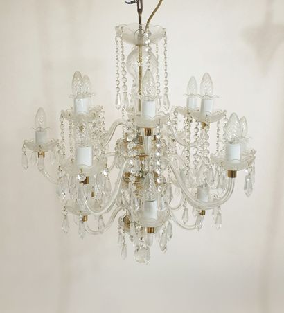null Large cut-crystal chandelier with eighteen lights in three rows, adorned with...
