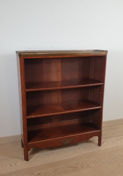 null Rosewood and amaranth veneered bookcase with floral marquetry on the sides....