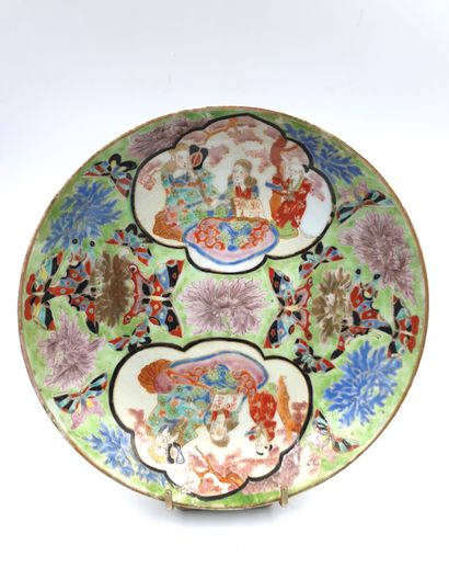 null Japan, circa 1900
Porcelain plate with polychrome decoration of figures in medallions...