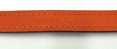 null HERMES, orange leather bracelet and monogrammed metal anchor chain fastening
Signed...
