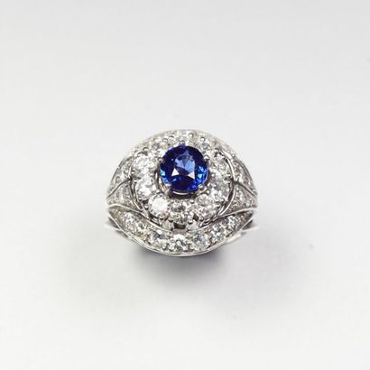 null Platinum ring (850/oo) centered on a round sapphire calibrating approximately...