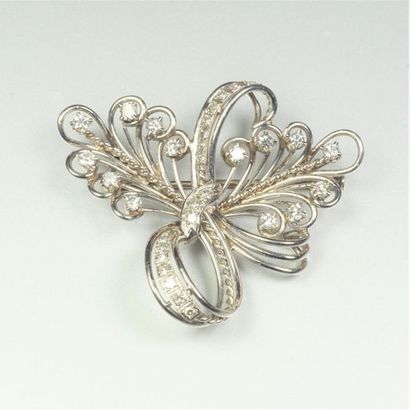 null Bow" brooch in 18K (750/oo) white gold and platinum (850/oo) with openwork decoration...