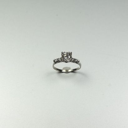 null Platinum ring (850/oo) centered on an old cut diamond calibrating 1.05 ct supported...