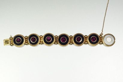 null 18K (750/oo) yellow gold bracelet with seven round links decorated with chiseled...