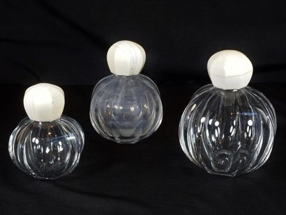 BACCARAT Three crystal flasks, ivory stoppers.