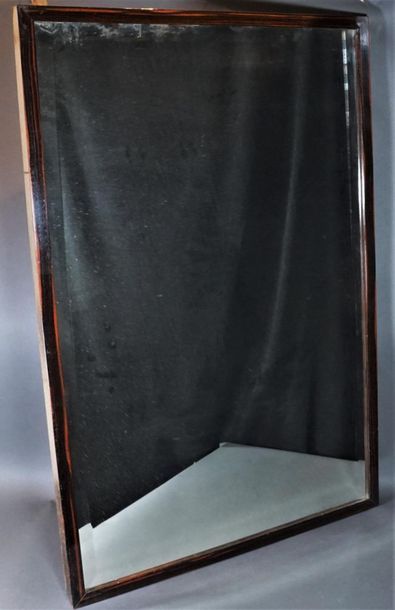 null Mirror in a varnished wooden frame.