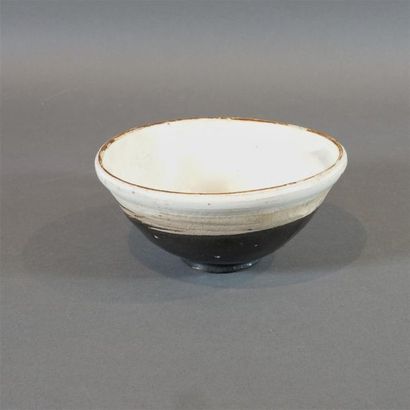 null Temmoku bowl in brown enamelled stoneware in different shades, the lip with...