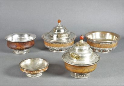 null Set of five containers comprising: two covered wooden bowls with a silver metal...