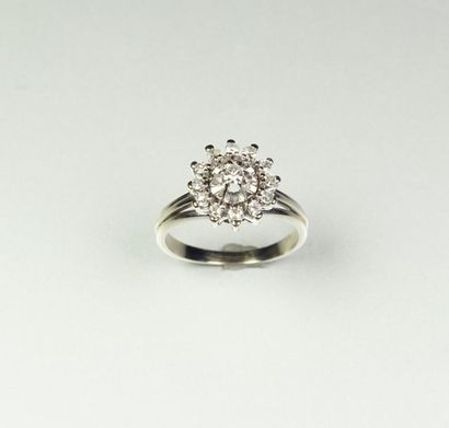 null Flower" ring in 18K (750/oo) white gold set with 8x8 cut diamonds and centered...