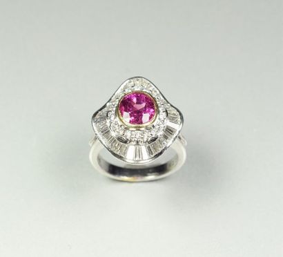 null Platinum ring (850/oo) centered on an oval ruby calibrating approximately 1.90...