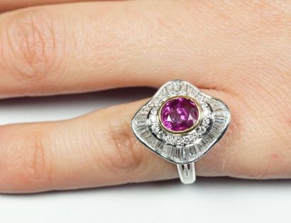 null Platinum ring (850/oo) centered on an oval ruby calibrating approximately 1.90...