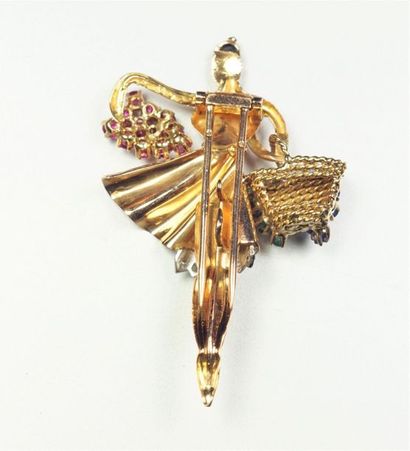 null 18K (750/oo) yellow gold clip brooch featuring a ballerina adorned with a basket...