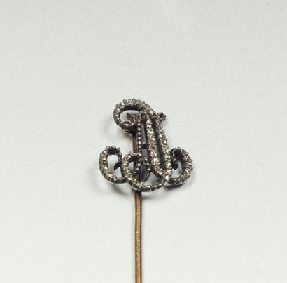  Tie pin in 18K (750/oo) yellow gold and silver (800/oo) with the monogram "J.A"...
