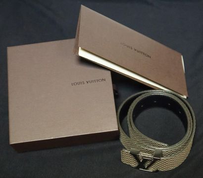 LOUIS VUITTON Paris - Taupe embossed leather belt with silver "LV" buckle. Length...