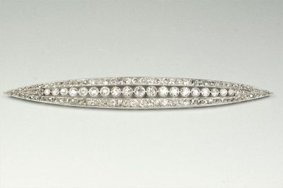 TEMPLIER Shuttle-shaped platinum brooch (850/oo) with openwork decoration, it is...