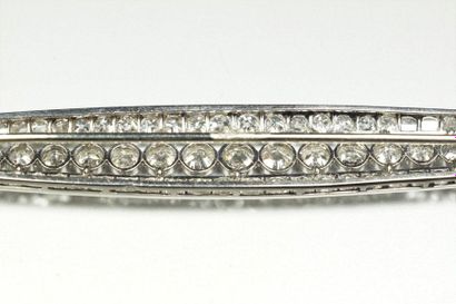 TEMPLIER Shuttle-shaped platinum brooch (850/oo) with openwork decoration, it is...