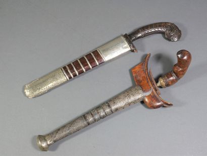 Set of two daggers : - a Kriss with wooden...