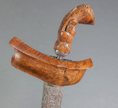 null Large Kriss with exotic wood handle decorated with a stylized head. Beautiful...