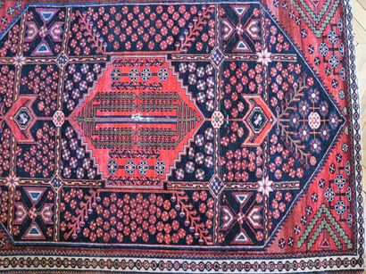 null Oriental carpet with navy and red background and geometrical decoration (cut...
