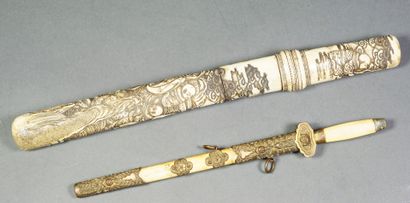 null 
 Set of two knives : a knife with a bone handle and scabbard decorated with...