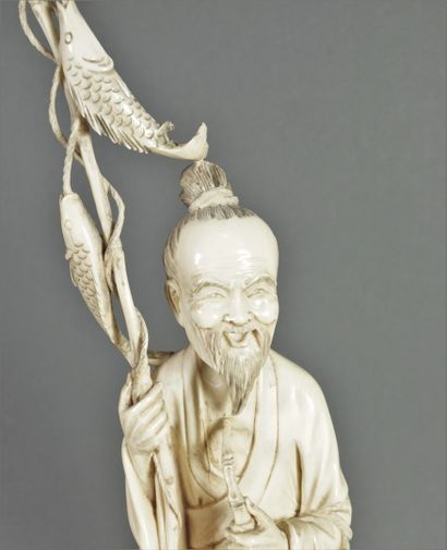 null Ivory statuette, a fisherman standing, a man crouching beside him. Terrace in...