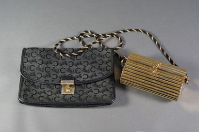 CELINE A vintage clutch bag in monogrammed canvas and black leather with a gilt metal...