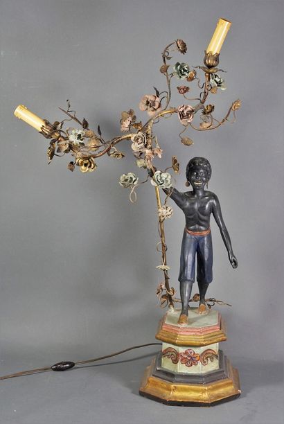 null Luminary in carved wood and bronze representing a black man carrying a flowery...