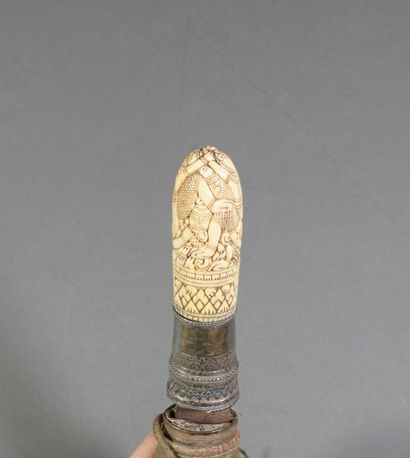 null 
Dagger . Ivory handle carved in the round with entangled characters. Silver...