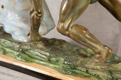 MAX LE VERRIER PENDULE Proof in bronze with green patina representing a man pushing...