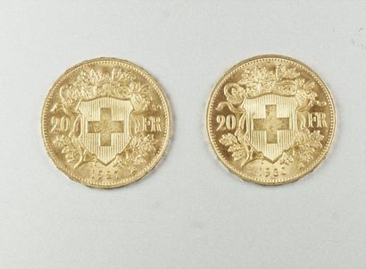 null Lot including two 20 Swiss francs gold coins (1927 and 1930).