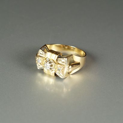 null 18K (750/oo) gold "Butterfly Tie" ring centered on a brilliant-cut diamond,...