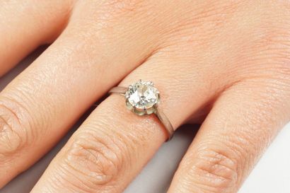 null Platinum (850/oo) solitaire ring centered on an old-cut diamond weighing approximately...