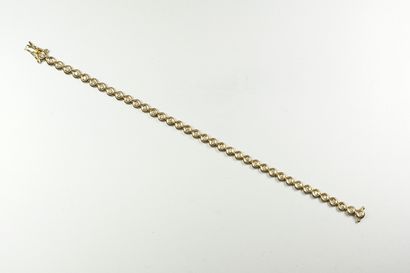 null Bracelet ligne en or jaune 18K (750/oo) composé de maillons ronds articulés,...