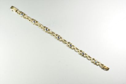 null Bracelet en or jaune 18K (750/oo) à maillons fantaisie articulés et ajourés...